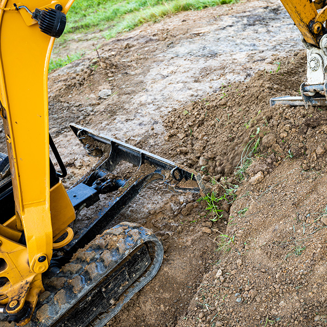 mini-excavator-digging-close-up